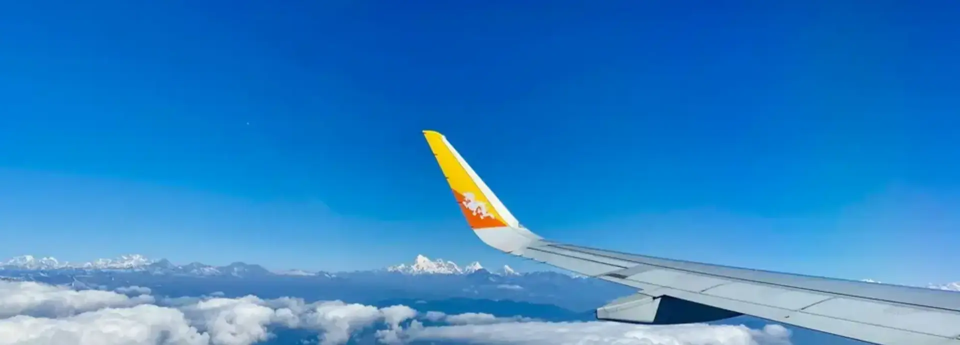 Wings of Royal Bhutan Airlines Airplane flying in the air