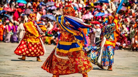 Mask dancers performing during Thimphu Tshechu at Tendrel Thang