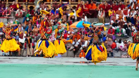 Mask dancers performing during the public days of Thimphu Drubchen
