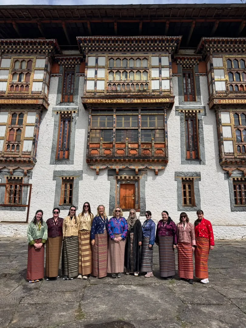 Booking Bhutan Yourself vs. Using a Bhutan Tour Operator: What's the Difference? - female group tour local attire large